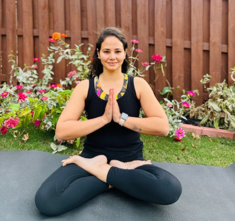Woman in seated forward bend pose
