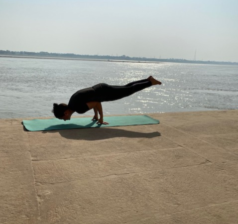 Woman in seated forward bend pose