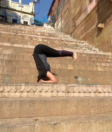 Woman in seated forward bend pose