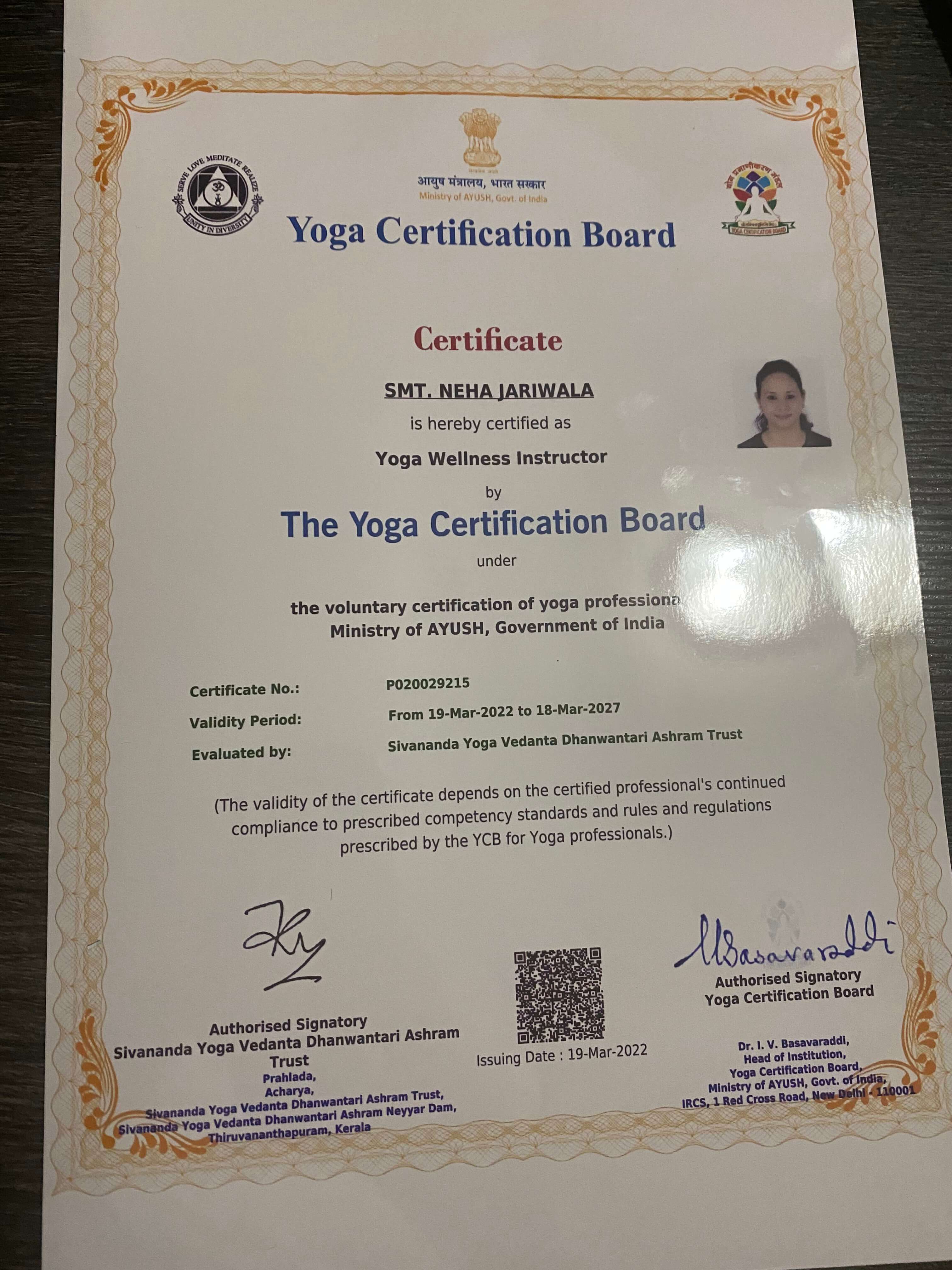 Woman seated on yoga mat