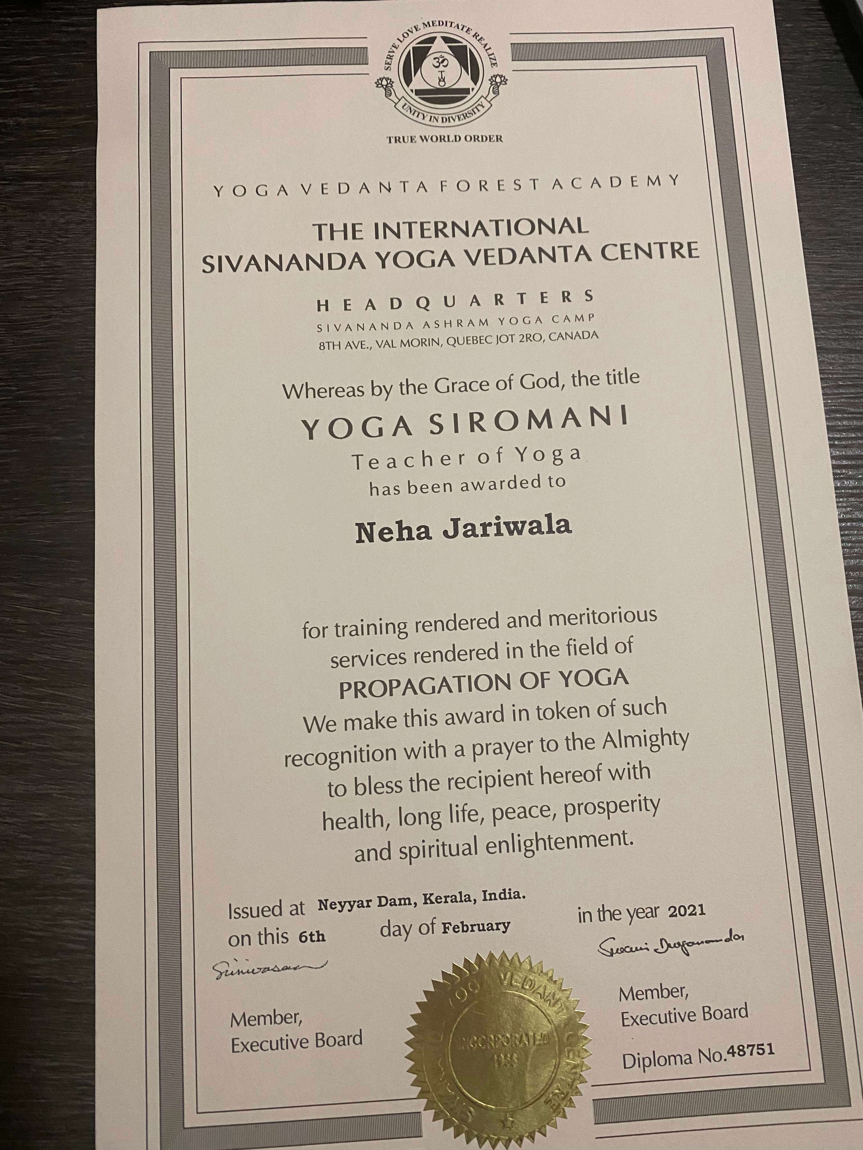 Woman seated on yoga mat