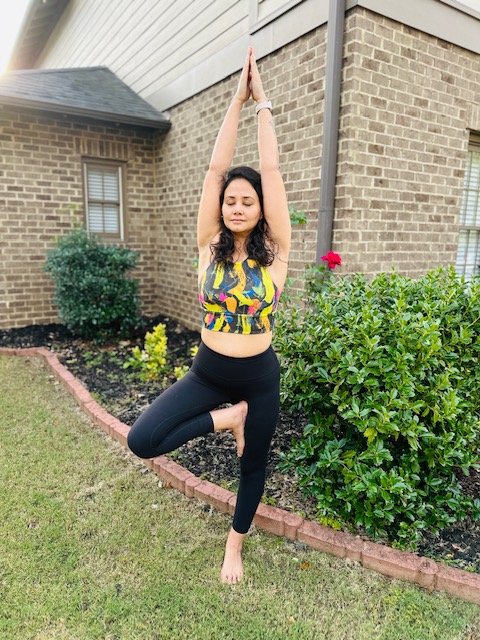 Woman seated on yoga mat