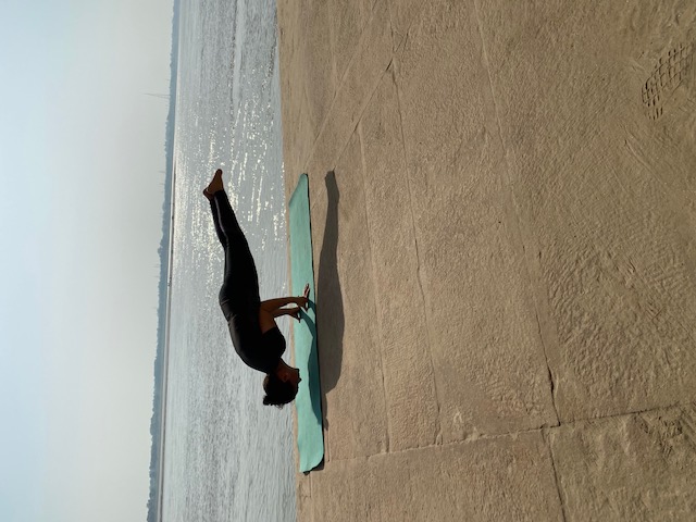 Woman seated on yoga mat