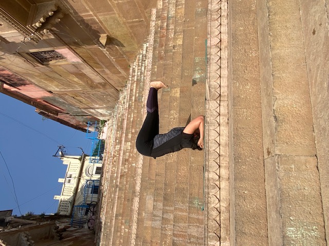 Woman seated on yoga mat